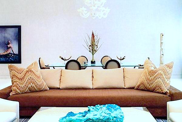 Ikat chevron pillows on a brown modern sofa