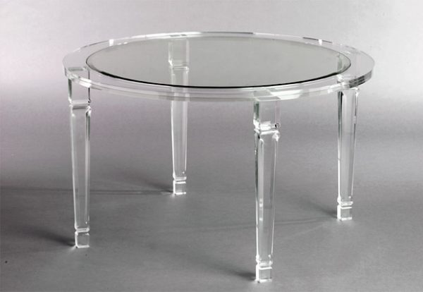 An acrylic round dining table