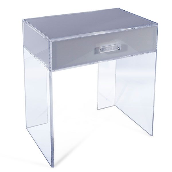 An acrylic side table with a drawer