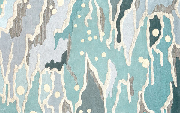 An ocean-inspired modern rug in shades of the sea