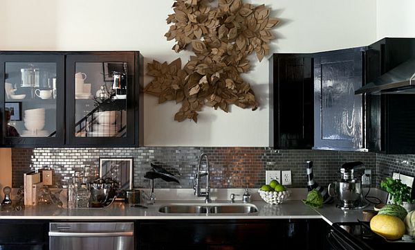 Black kitchen furniture and dark backsplash design