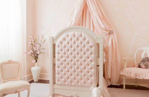 Carefully concealed Sleeping Beauty baby bedding in picture perfect pink