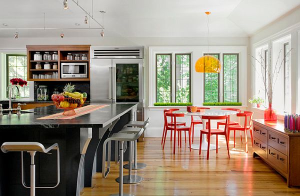 Colorful kitchen design with large black island