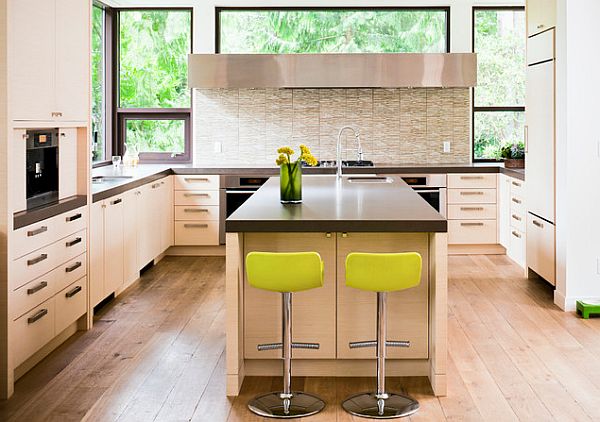 Cream colored kitchen with cutting-edge appliances and lime neon bar stools