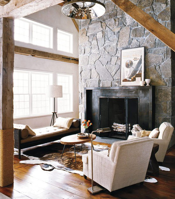 Dark fireplace complements lovely light colored decor