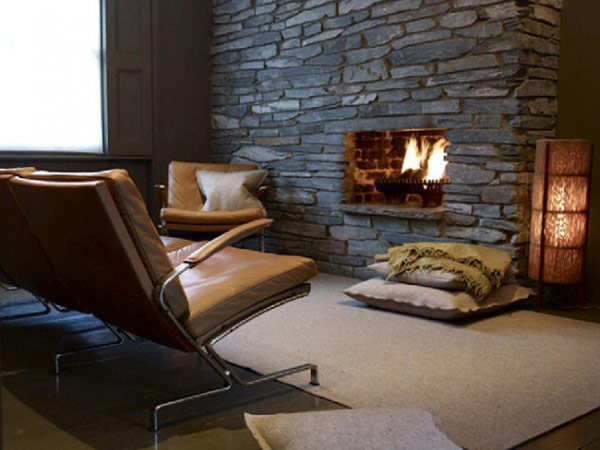 Dark stone fireplace offers an intimate setting