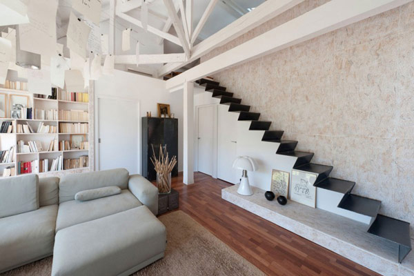 Huge hidden storage shelf under sleek modern stairs