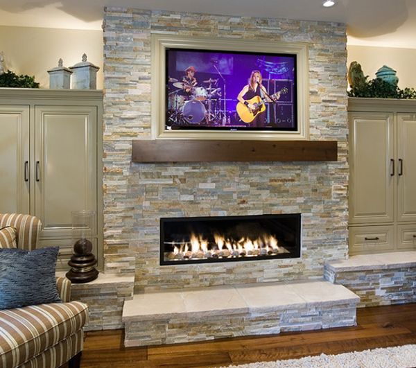 Linear fireplace with a flat screen TV on top