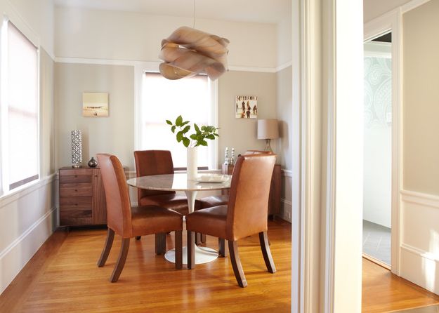 Modern dining room and chairs with sumptuous hanging lighting fixture