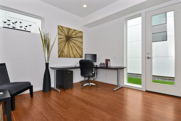 Modern home office with sleek black corner table