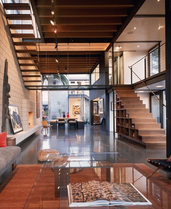 Modern living room sporting stairs with integrated shelves