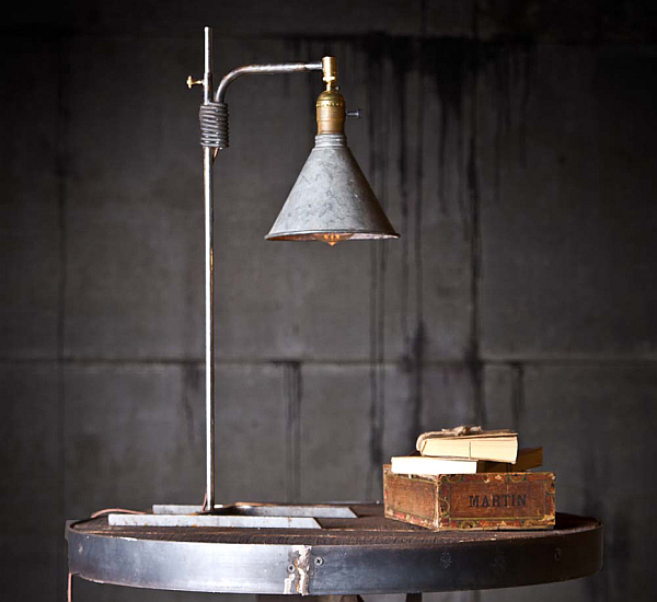 Reading lamp made from distressed funnels