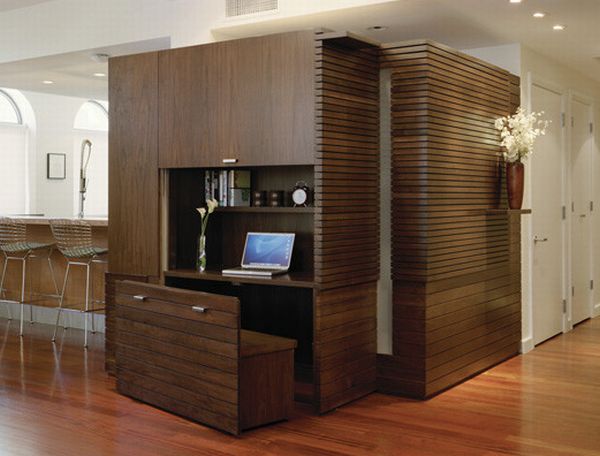 Savvy home office with a wooden bench that disappears into the unit