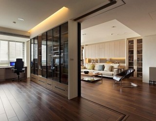Modern apartment with retractable glass walls for home office area
