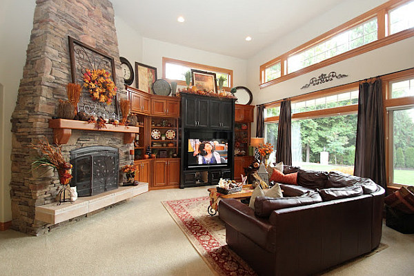 stone fireplace design with wreath over the mantle