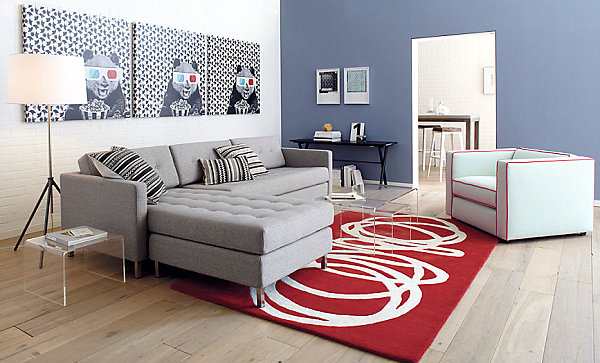 A modern grey tufted sectional sofa