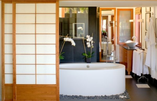 Black granite Japanese bathroom with oval bathtub