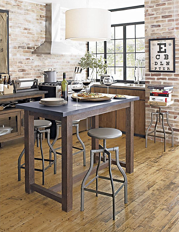 Industrial seating surrounds a high kitchen table