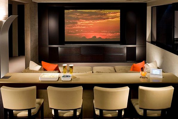 Theater styled media room with built in dining bar