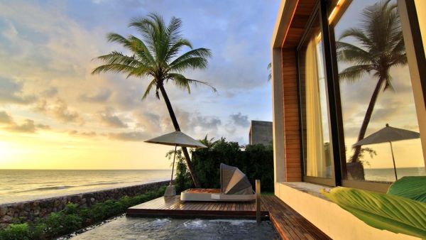 beach house with hot tub and wooden deck