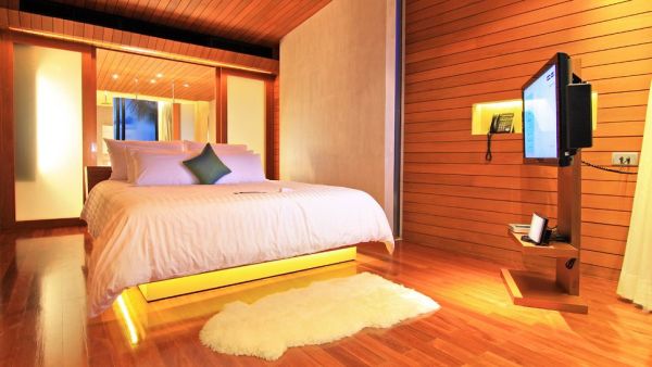 beachfront suite bedroom with wooden walls