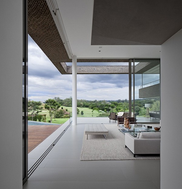 contemporary living room with leather couch and chairs