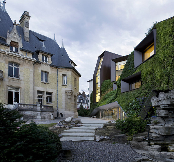 modern building covered in green