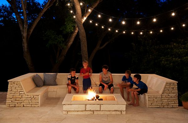 outdoor space with built-in seating and firepit