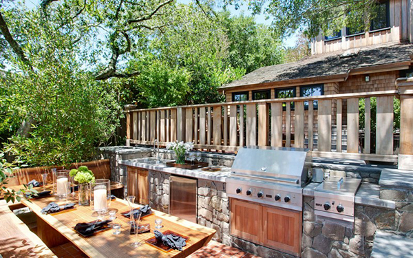 summer kitchen with barbecue and beautiful dining table