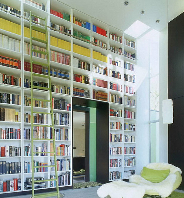 wall turned bookcase with staircase