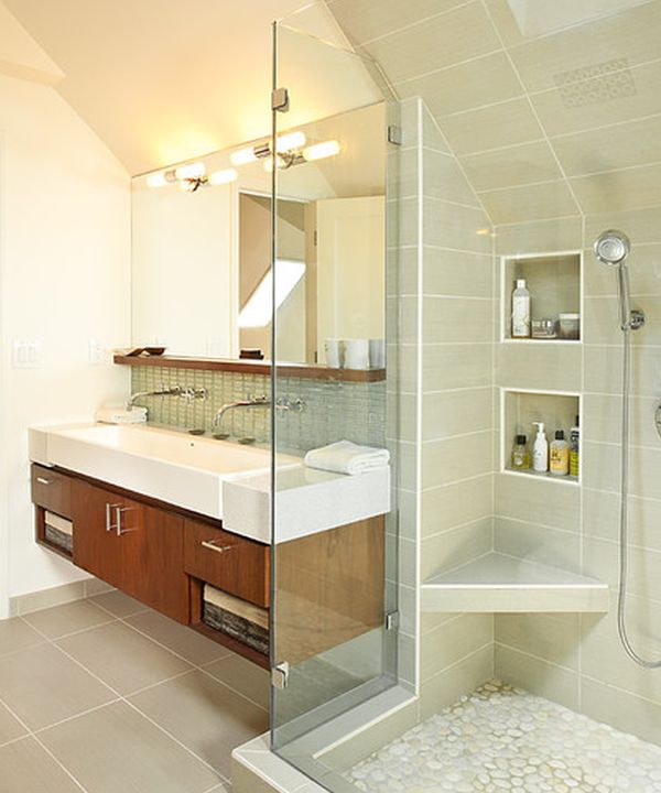 Classy floating sink cabinet set in a contemporary bathroom clad in glass