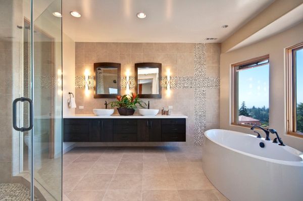 Elegant modern master bathroom with warm colors and floating cabinet