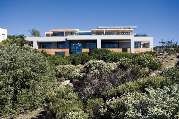 Lush green surroundings adjacent to the modern beach house