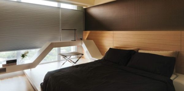 Master bedroom with headboard along the window wall