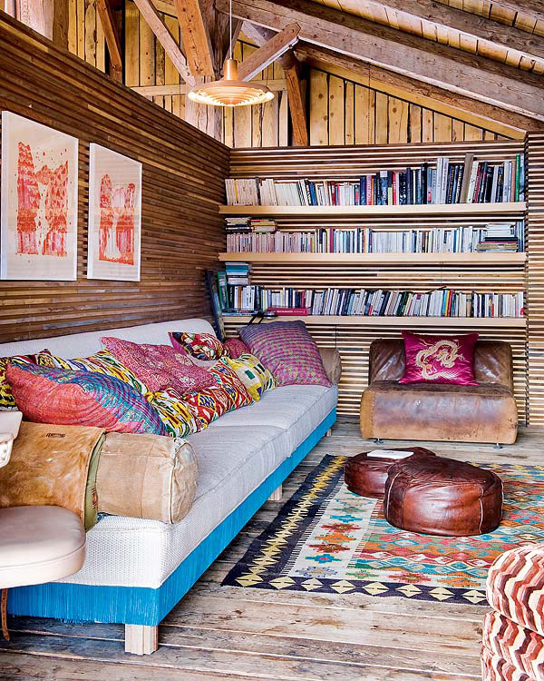 Plush-couch-nestled-against-a-rustic-wooden-backdrop