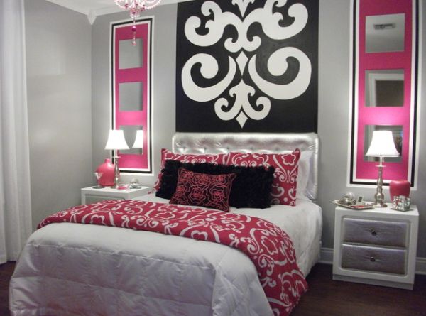 Silver tufted headboard adds to this bedroom with vivid art in black and pink