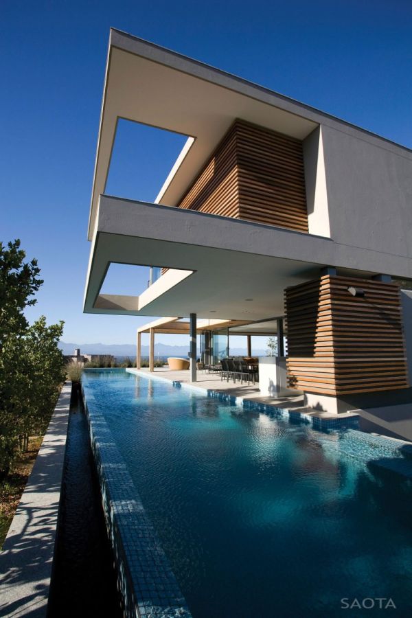 Soothing pool and natural timber wooden shutters