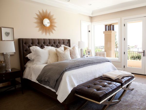 Traditional bedroom design with tufted headboard and tufted benches at foot