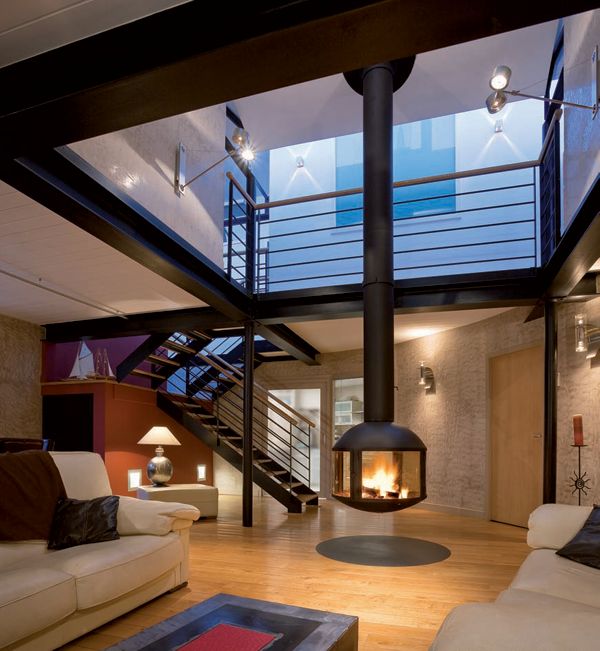 Modern home with a suspended circular fireplace