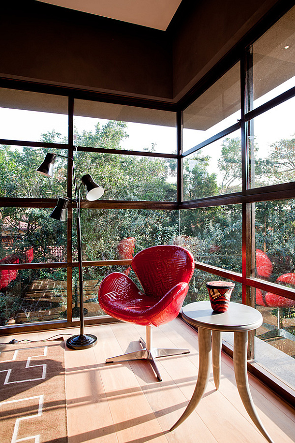 red-chair-and-small-diy-coffee-table-made-from-elephant-tusks