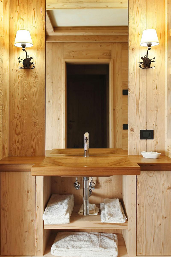 wooden bathroom with wall sconce