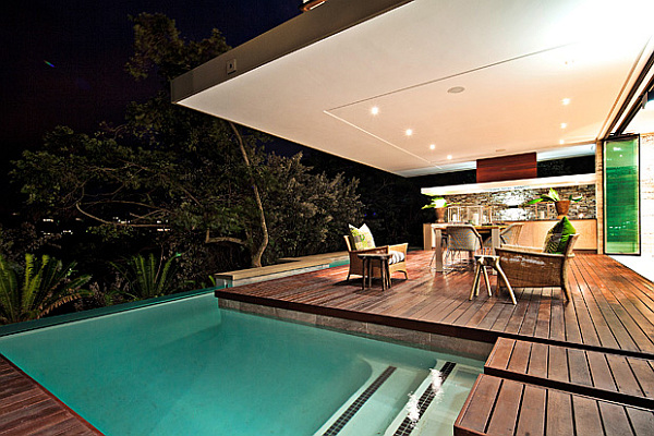 wooden deck with bar and small pool