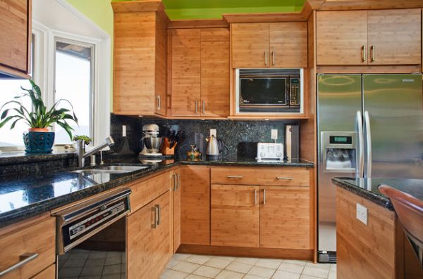 Bamboo cabinetry and a touch of green give this contemporary Californian kitchen an Asian flavor