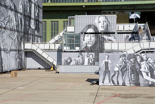 Bold and hip graffiti on top of the container homes