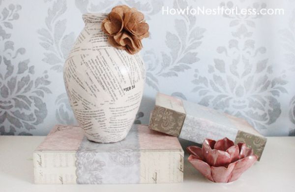 Book pages decorate this old vase giving it a new look