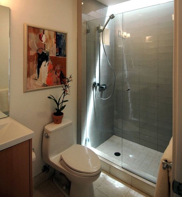 Contemporary bath with glass shower doors and warm hues