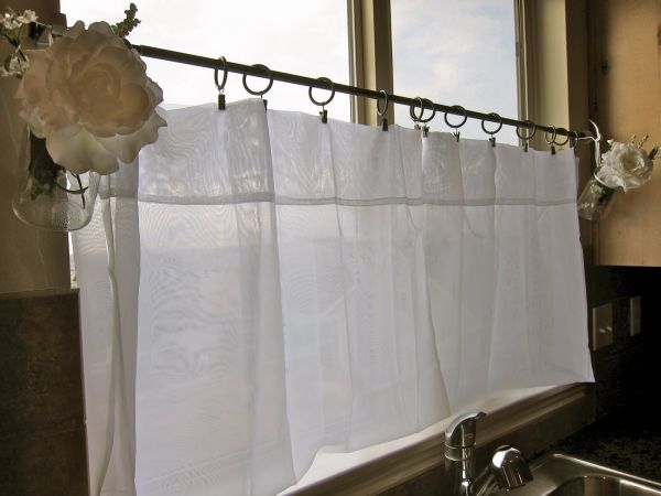 Sheer cafe curtains make a great addition to any kitchen