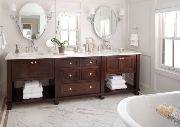 Exquisite bathroom vanity in dark tones complements the pristine white backdrop