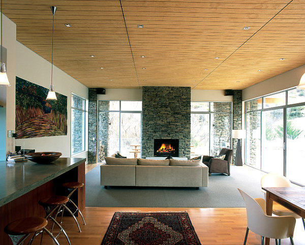 Fireplace mirrors the home's exterior stone