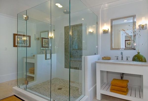 Glass shower area creates a spa-like relaxing environment with its cool design